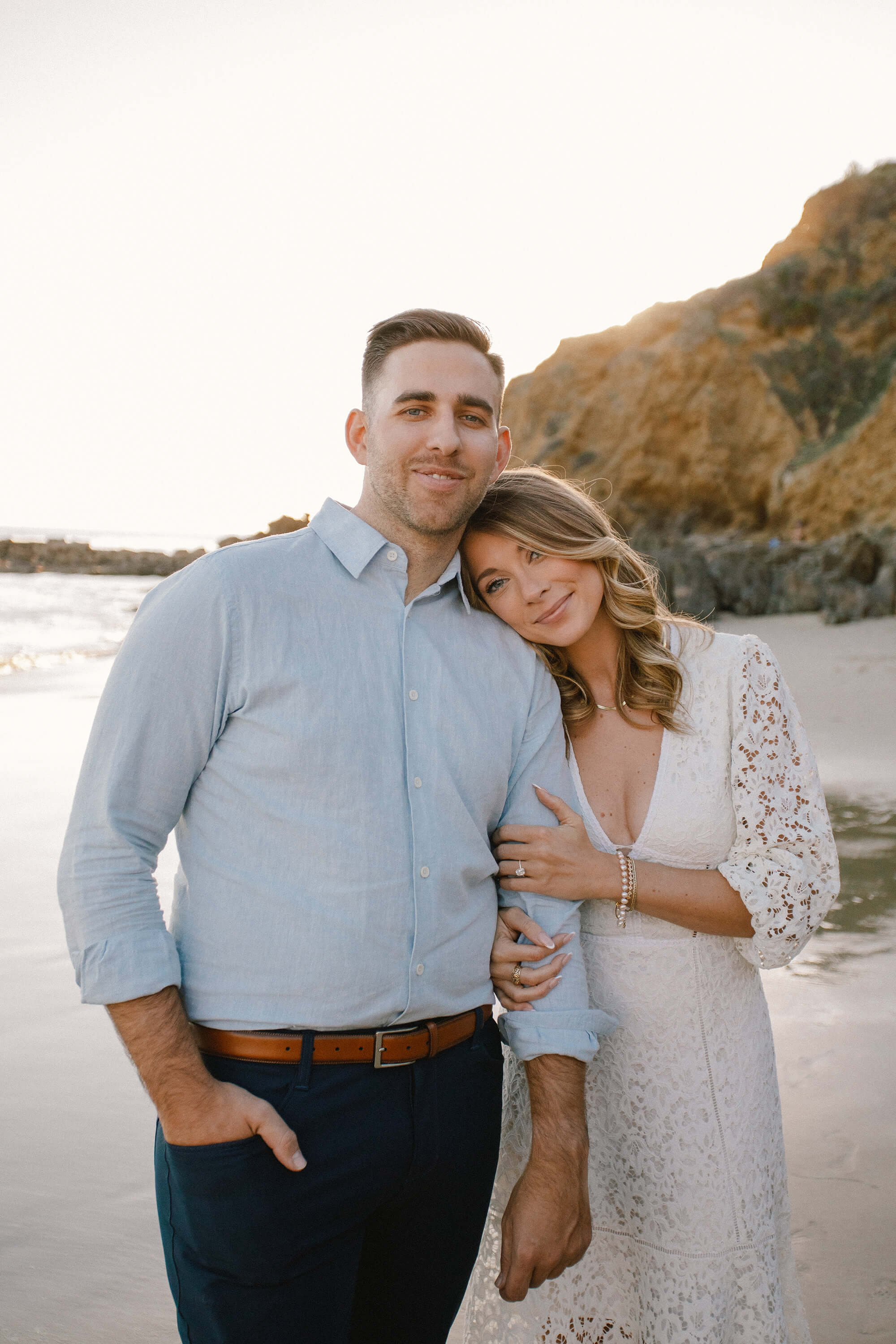 Kait resting her head on JJ's shoulder.